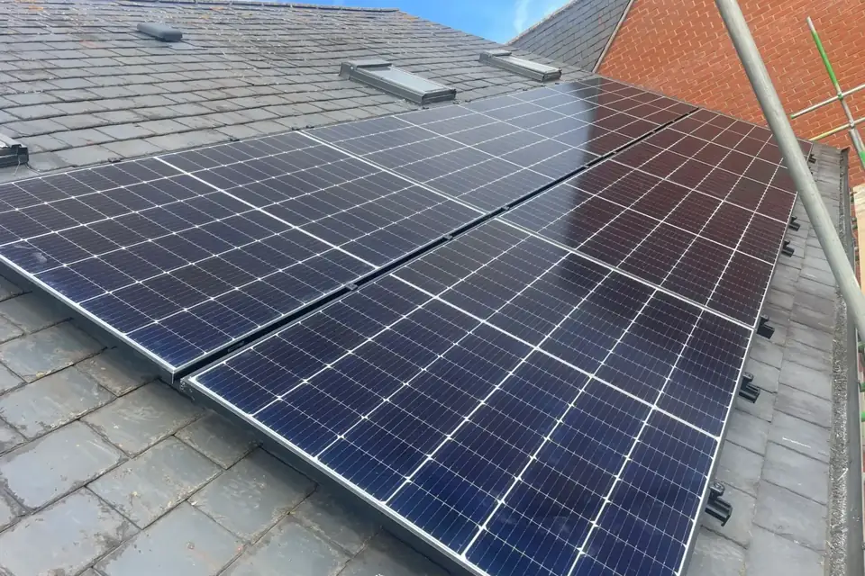 Solar panel installation being carried out on a Northampton roof